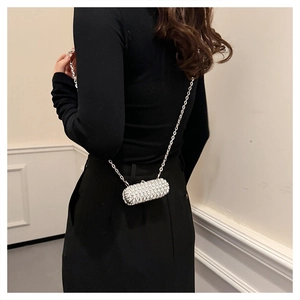 Capsule shape mini evening bag with sparkling rhinestones and silver chain strap