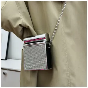 Chic silver hard shell crossbody bag with sparkling rhinestones and metal chain strap