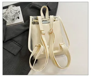 Detail of adjustable cream leather straps on a transparent PVC mini backpack