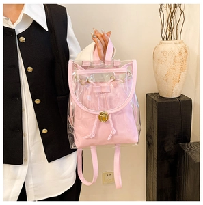 Macro detail of pink transparent jelly backpack with interior drawstring pouch and gold buckle