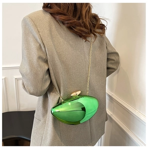 Fashionable green acrylic mango bag with metallic mirror finish and golden chain strap