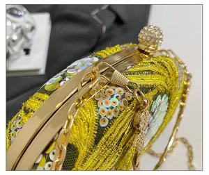 Detailed macro shot of luxury gold clasp with sparkling rhinestones and lace floral sequins