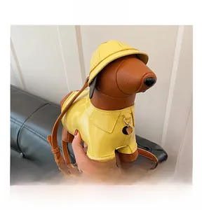Detail show of creative dachshund crossbody bag with yellow lacquer and brown leather texture