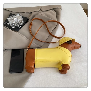 Creative dachshund crossbody bag with yellow raincoat detail on a minimalist background