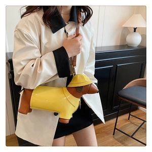 Detail shot of creative dachshund shoulder bag with yellow and brown textured faux leather