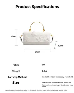 Detail view of white PU leather bag with lace butterflies and golden metal handle