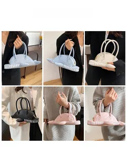 Detailed views of creative whale-shaped handbags in four colors held by a model