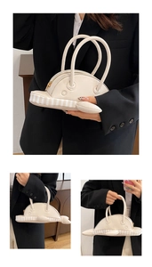 Detailed view of creative whale-shaped handbag with premium PU leather and striped details