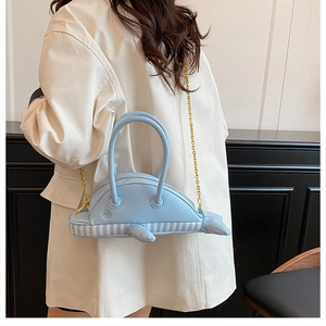 Detail showing creative light blue dolphin bag with metal chain strap and PU texture