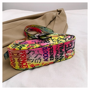 Detail of colorful gradient leather shoulder bag with artistic black graffiti print