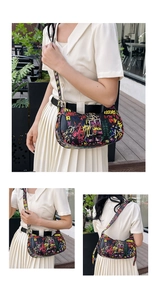 Detail of black underarm bag featuring vibrant graffiti letters and adjustable strap