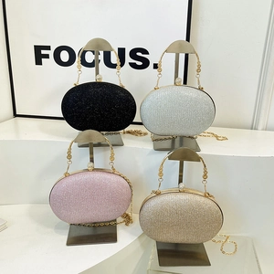 Chic glitter box bags in four colors with hollow metal handles and chain straps