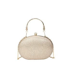 Sparkly champagne gold hard shell evening clutch bag with flower handle and chain strap