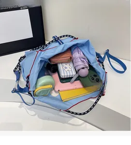 Top view of large capacity tote bag interior showing tablets and essentials