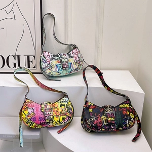 Graffiti printed half-moon hobo bags in assorted colors with Y2K street style design