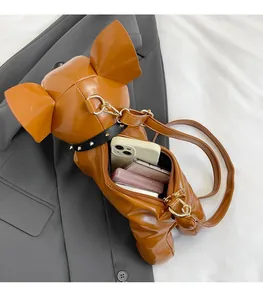 Detail view of the brown French Bulldog bag interior showing phone and makeup storage