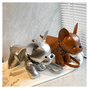 Detail of creative puppy-shaped crossbody bags in silver and brown leather with rivet collars