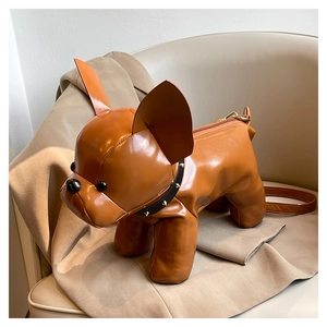 Detail of creative brown leather French bulldog crossbody bag with rivet collar