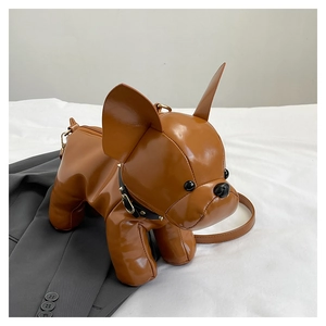 Detailed view of dog-shaped crossbody bag featuring glossy brown leather and rivet collar