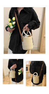 Macro detail of straw bucket bag with wooden beads handle and brown leather strap