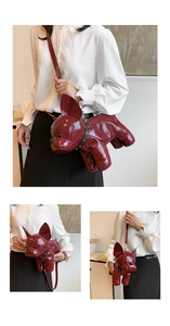 Detail of burgundy French Bulldog cross-body bag with glossy leather and black rivet collar