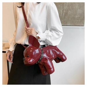 Detail of red French Bulldog crossbody bag in glossy PU leather with rivet collar