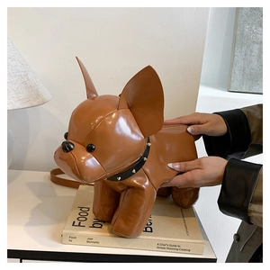 Detail showing brown leather French bulldog bag with rivet collar and zipper back