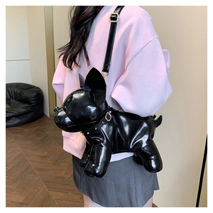 Glossy black French Bulldog shaped crossbody bag with adjustable strap and gold hardware