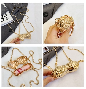 Macro detail of a gold peanut-shaped mini bag with textured metallic surface and chain