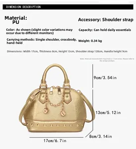 Detail view of gold shell bag with metallic rivets and decorative chain pendant