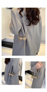 Detailed view of the creative gold peanut-shaped metal mini bag with chic bead chain