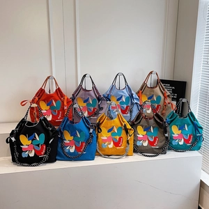 Japanese style cartoon embroidered tote bags in nine colors with striped handles