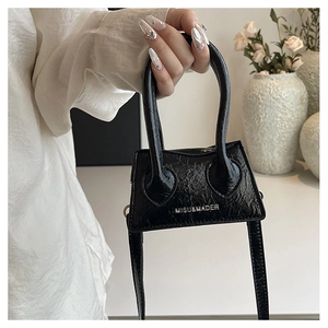 Close-up of black glossy crackle texture mini handbag with MISU&MADER metal logo