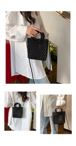 Detailed close-up of mini black beaded woven tote bag with handle and crossbody strap