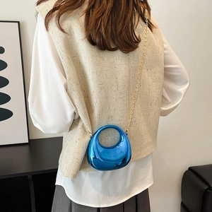 Metallic blue half-moon acrylic clutch bag with gold chain and circular handle