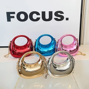 Mini acrylic crescent bags in five metallic colors with gold chain straps and sleek top handles