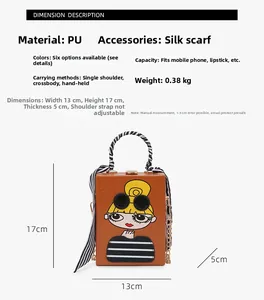 Detail view of the cartoon box clutch with measurements, chain strap and scarf handle