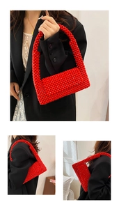 Detailed view of vibrant red beaded shoulder bag with intricate acrylic weave texture