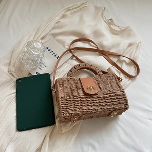 Rectangular woven straw handbag with brown leather flap and golden twist lock for summer