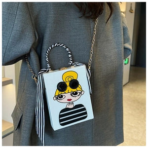 Chic box clutch with vintage cartoon girl print and silk scarf handle detail