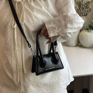 Mini black crossbody bag with glossy wrinkled texture and detachable metal strap for women