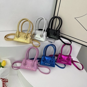 Mini trapezoid handbags in metallic faux leather with long top handles and crossbody straps