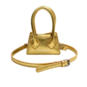 Mini metallic gold crossbody bag with textured faux leather and adjustable shoulder strap