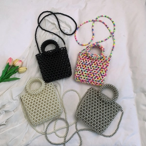 Mini jelly bead handbags in black, white, gray, and rainbow colors with crossbody straps
