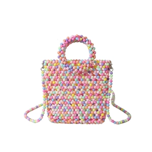 Mini macaron woven bead tote bag with colorful beads and a long shoulder strap