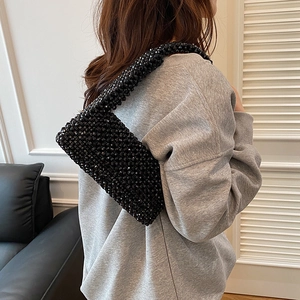 Handmade black acrylic beaded shoulder bag with woven texture for women's fashion