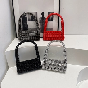 Fashionable woven beaded shoulder bags in four colors on a white minimalist platform