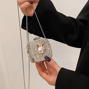 Mini silver heart crossbody bag with rhinestone finish and metal fox head decoration