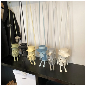 Detailed view of six colorful cartoon jacket-shaped crossbody bags in various pastel colors