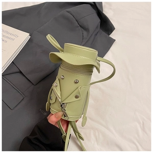 Detailed view of the cute mini light green cylindrical crossbody bag with character design